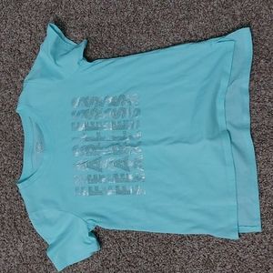 Light blue shirt with fearless written on it